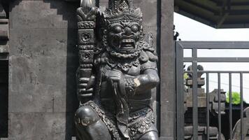 Balinese Hindu Temple, traditional Balinese building architecture with beautiful carved statues, photo