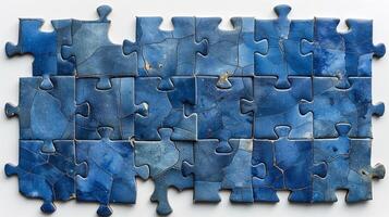 A vibrant blue puzzle featuring intricate patterns and textures, symbolizing creativity and problem-solving. photo