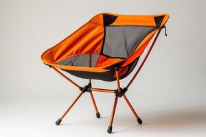 A vibrant orange camping chair featuring a modern design, perfect for outdoor activities and relaxation. photo
