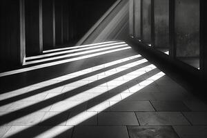 Abstract monochrome image of light and shadow creating striking patterns on a floor. photo