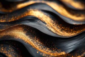 Close-up of black waves with shimmering gold dust creating a luxurious, textured surface. photo