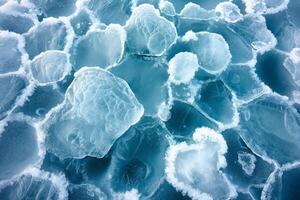 Close-up of icy blue sea ice with unique textures and shapes, creating a serene winter atmosphere. photo