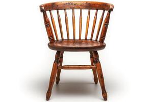 A rustic wooden chair with a classic spindle-back design, showcasing its natural grain and weathered finish. photo