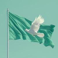 A graceful white dove soars next to a green flag, symbolizing peace and hope in a serene atmosphere. photo