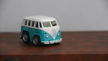 Miniature retro blue and white bus toy. photo