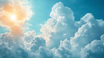 A breathtaking view of fluffy white clouds against a bright blue sky, illuminated by warm sunlight. photo