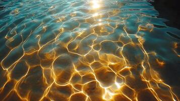 Glittering sunlight reflects on the tranquil surface of the water, creating mesmerizing golden patterns. photo