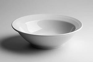 A pristine white ceramic bowl with a smooth finish, elegantly reflecting light against a soft gray backdrop. photo