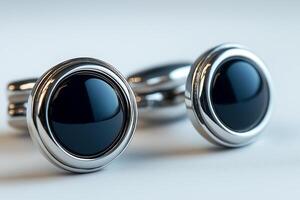 Elegant silver and black cufflinks, ideal for formal occasions and adding a sophisticated touch to attire. photo