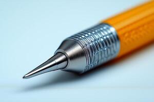Close-up of a sleek silver and orange mechanical pencil reflecting light, showcasing its intricate design and sharp tip. photo