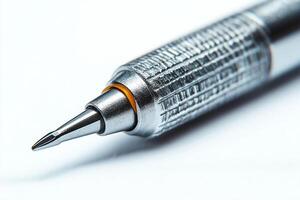 Close-up of a sleek silver mechanical pencil highlighting its precision tip and textured grip. photo