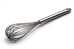 A sleek silver whisk lying on a white surface, perfect for culinary tasks. photo