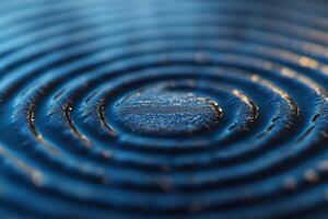 Close-up of concentric water ripples on a blue surface, creating a serene and calming effect. photo