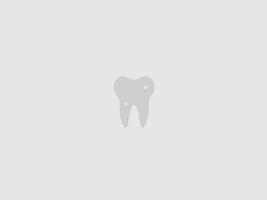 stylized tooth is shown in the center of a plain background vector