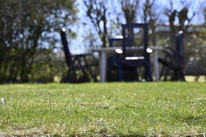 Serene Garden with Table and unsharped Chairs photo