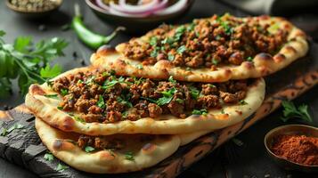 Creative serving of keema naan from India with spiced minced meat baked inside soft bread styled in a modern high resolution gourmet food art composition photo
