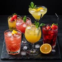 A group of different drinks on a black slate photo