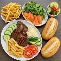 A table with a plate of food and a bowl of chips photo