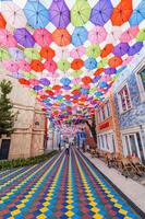 Multicolored bright colorful umbrellas decoration Magic City Park in Tashkent. Tashkent, Uzbekistan - June 15, 2024 photo