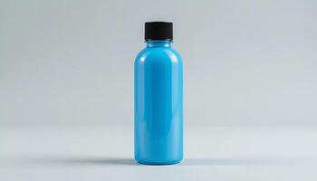 Blue Bottle with Black Cap Mockup on White Background for Liquid photo