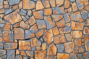 The texture of the walls is made of brown-gray stone, the background of the floor. photo