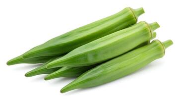 Fresh Green Okra Pods Pile on White Background Ready for Cooking photo