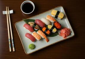 Assorted Sushi Nigiri Plate with Soy Sauce and Chopsticks Still Life photo