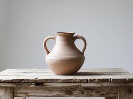 Handcrafted Clay Jug Pottery Vessel on Rustic Wooden Table. photo