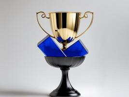 Golden trophy black pedestal is shape cup two Blue Award. photo