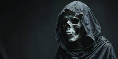 Eerie Skull Figure with Hooded Cloak in Dark Setting. photo