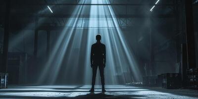 Silhouette of Person in Warehouse with Dramatic Lighting Effects photo