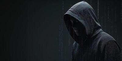silhouette of hooded hacker made of binary code photo
