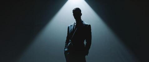 Silhouette in Spotlight with Dramatic Lighting Effects. photo