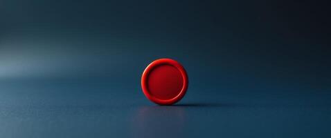 a close up of a red button on a dark blue background photo
