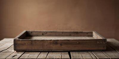 An empty wooden box sitting on top of a wooden table photo