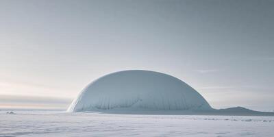 A large snow dome sitting on top of a snowy field photo