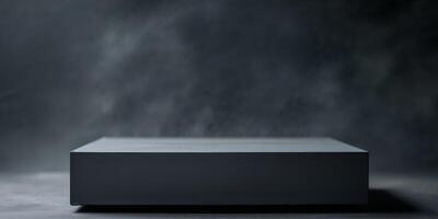Dark Gray Blank Rectangular Object on Dark Surface photo