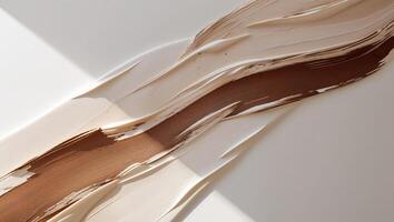 Abstract gradient artwork featuring brown and white textured brushstrokes on a surface. photo