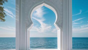 A white archway with a view of the ocean photo