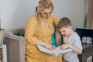 young boy listening to a woman reading concept of relaxation, comfort, and emotional connection in learning, plant photo