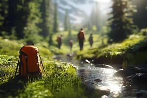 Group of hikers walking along a stream in a lush green meadow, sunlight filtering through trees photo
