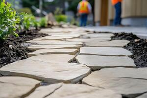 Close-Up of Stone Pathway with Workers in the Background Enhancing Landscape photo