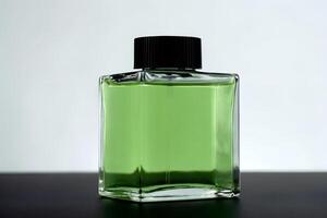 A green perfume bottle on a table photo
