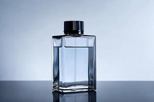 A clear bottle glass with a black cap on it photo