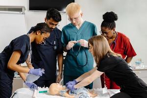 Medical Students Practicing Intubation Technique on Baby Mannequin during Training. photo