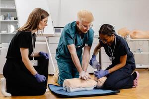 Doctors practicing cardiopulmonary resuscitation during medical training photo
