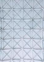 Elegant white vaulted ceiling with intricate partition patterns, creating a sense of architectural sophistication photo