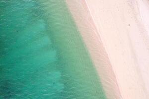 aerial view of pristine beach with turquoise water, overhead photography by drone photo