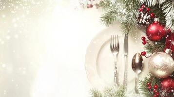 Christmas table setting with silverware and christmas decorations photo