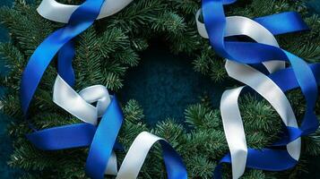A wreath with blue and white ribbons on it photo